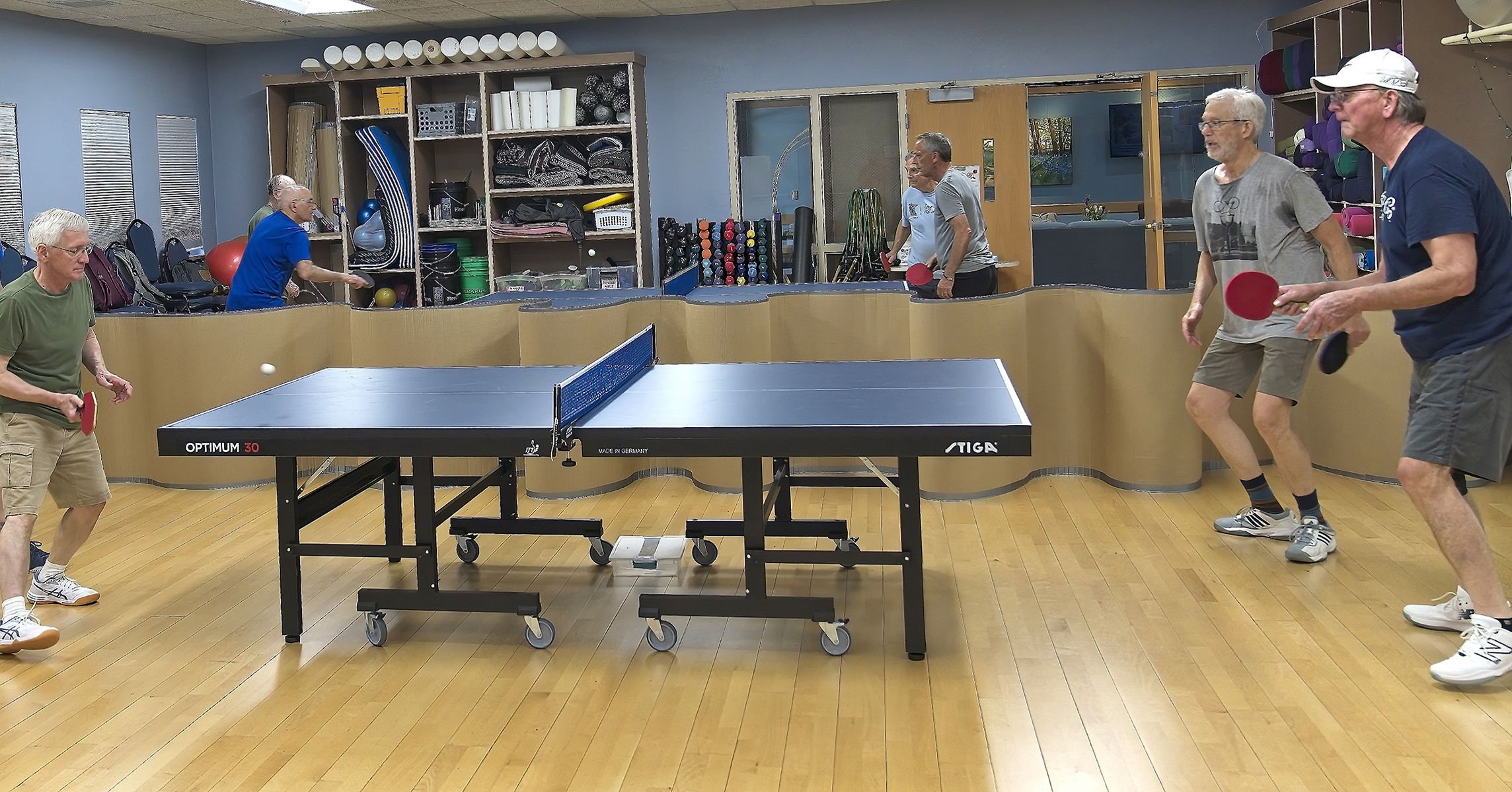 Men playing table tennis